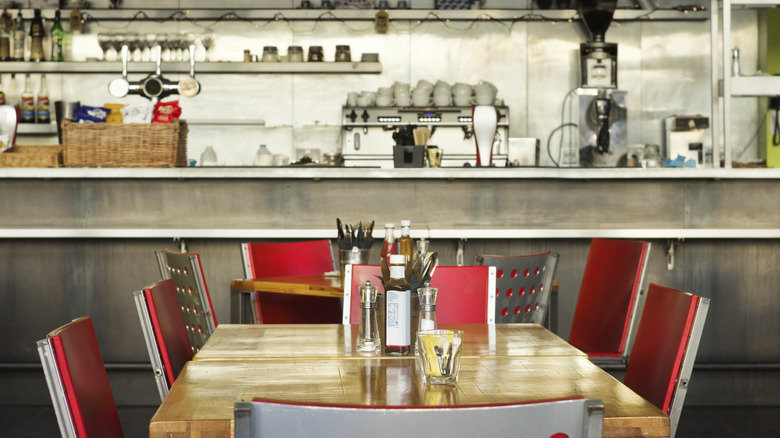 Diner table with kitchen in the background