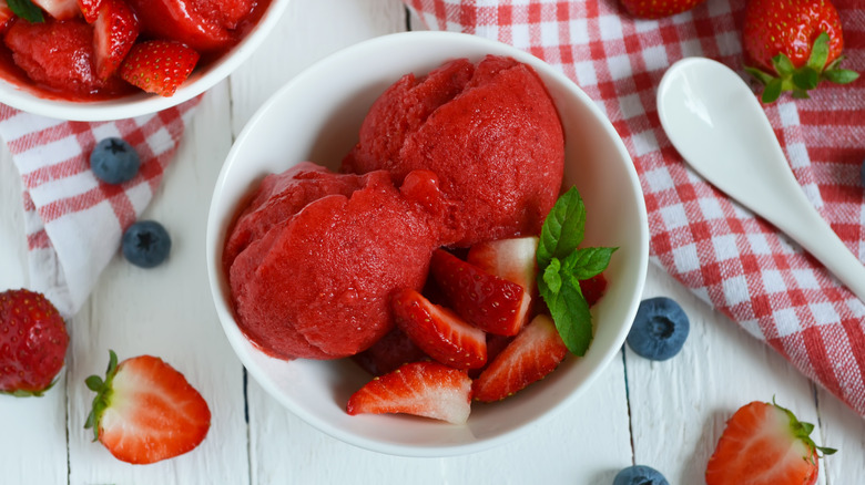 strawberry sorbet with berries, mint leaves