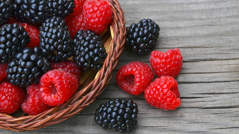 basket of raspberries and blackberries