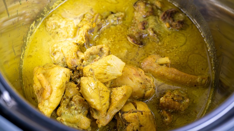 Thai curry cooking in a pot