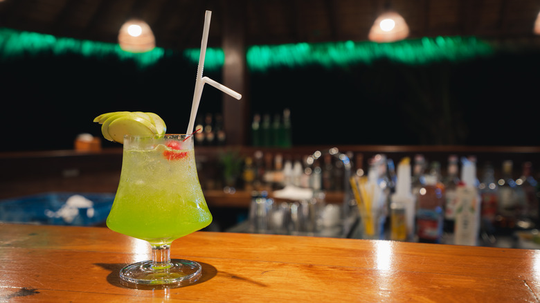 Midori sour cocktail on a bar