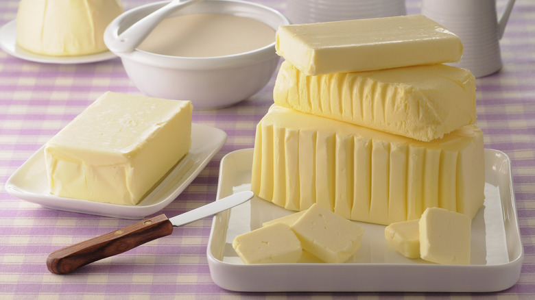 Blocks of butter on dishes