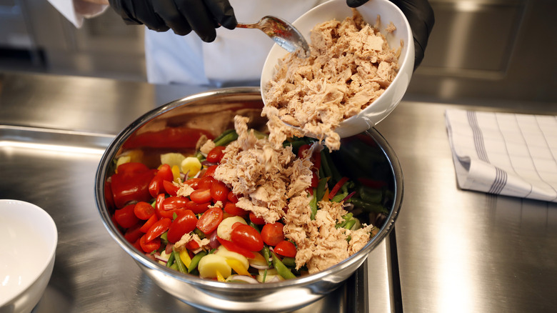 Chef batch making tuna salad