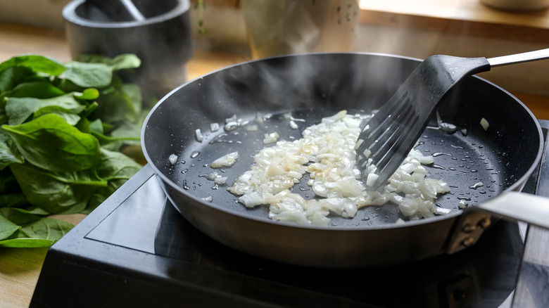 Sautéeing onions in a pan