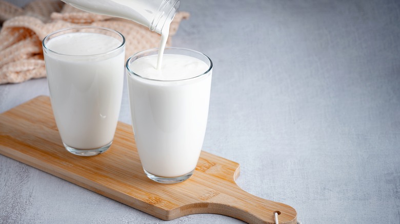 buttermilk being poured into glasses