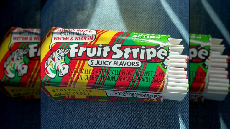 fruit stripe gum pack on jeans