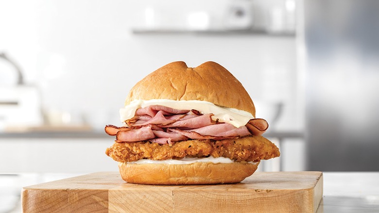 Arby's chicken cordon bleu sandwich on cutting board