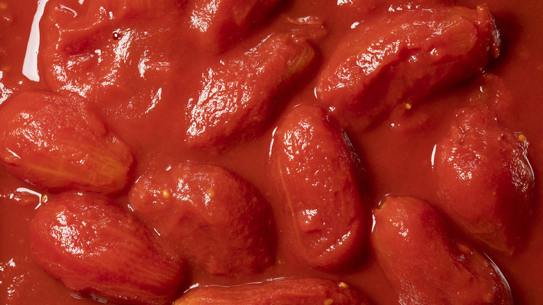 Whole canned tomatoes across screen