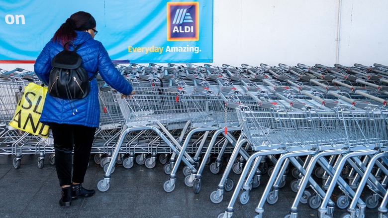 customer taking a cart at Aldi