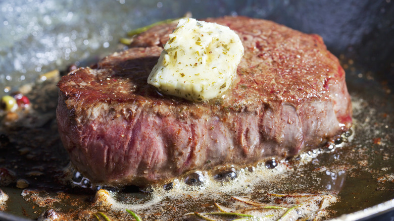 butter basted steak in pan