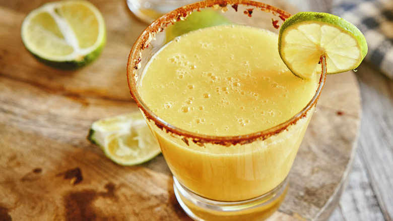 Mango margarita with lime and chili rim