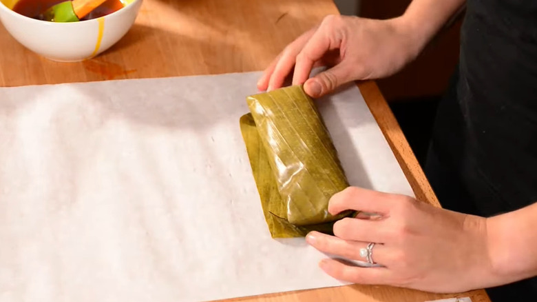 Pastele being wrapped in paper