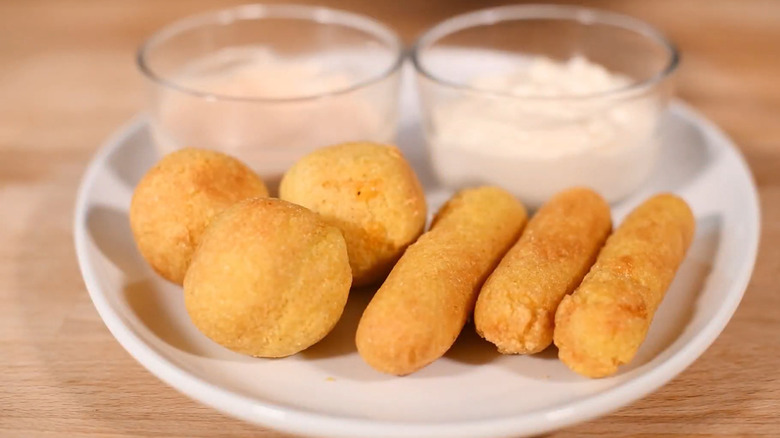 Sorullos on plate with dips