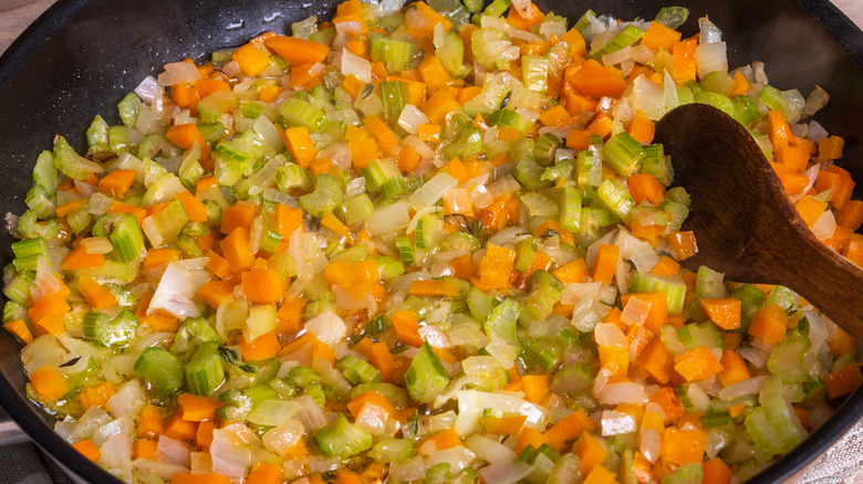 sauteing vegetables in a pan