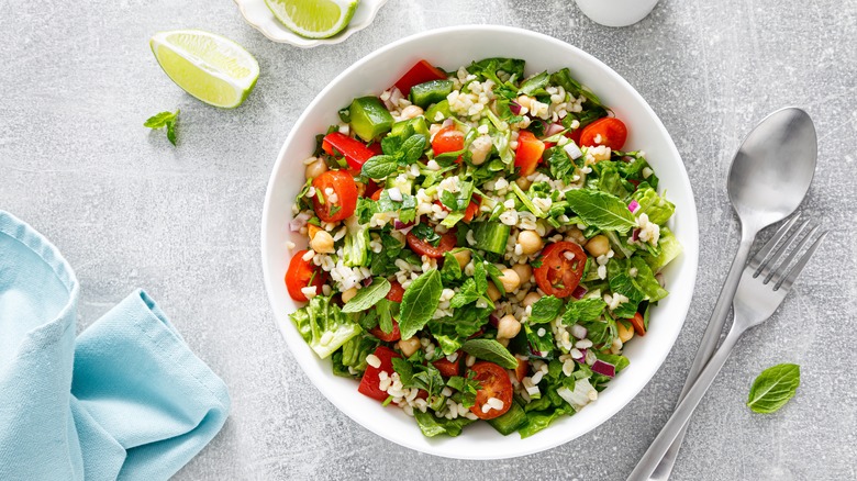 bowl of salad on gray countertop 