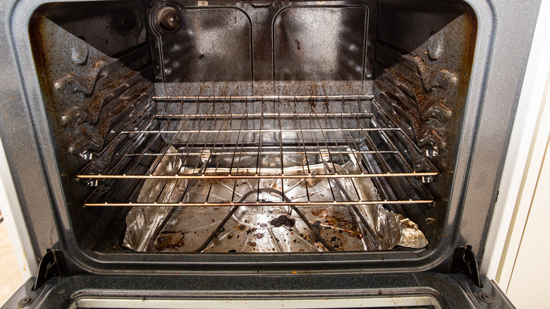 dirty oven filled with grease and grime