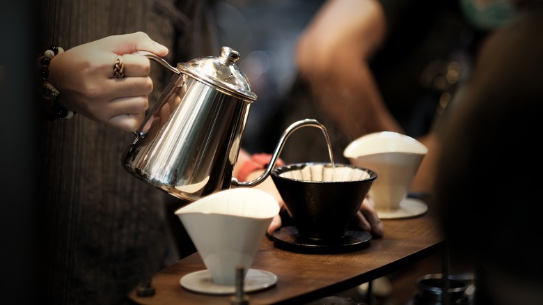 Person pouring coffee