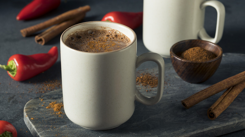 hot chocolate in mugs with peppers