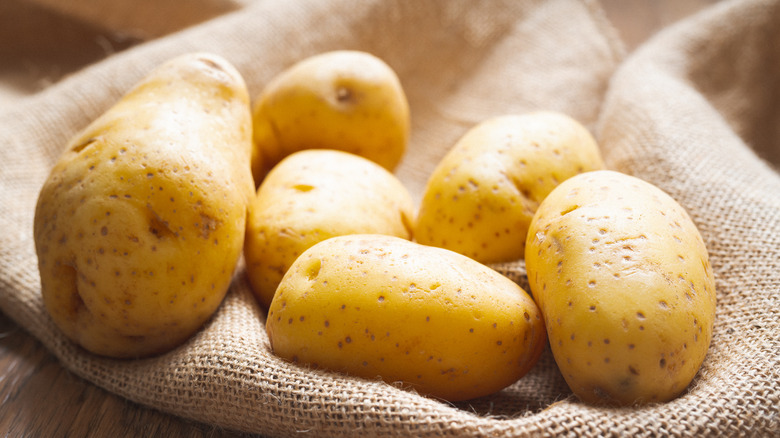 Yukon gold potatoes on burlap