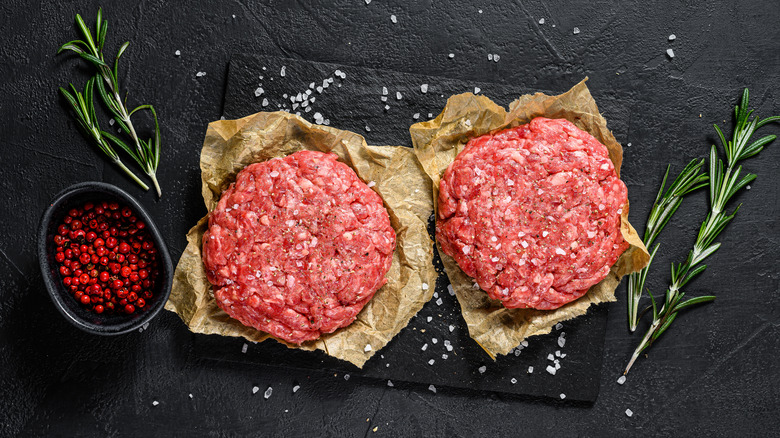 Homemade burger patties with herbs