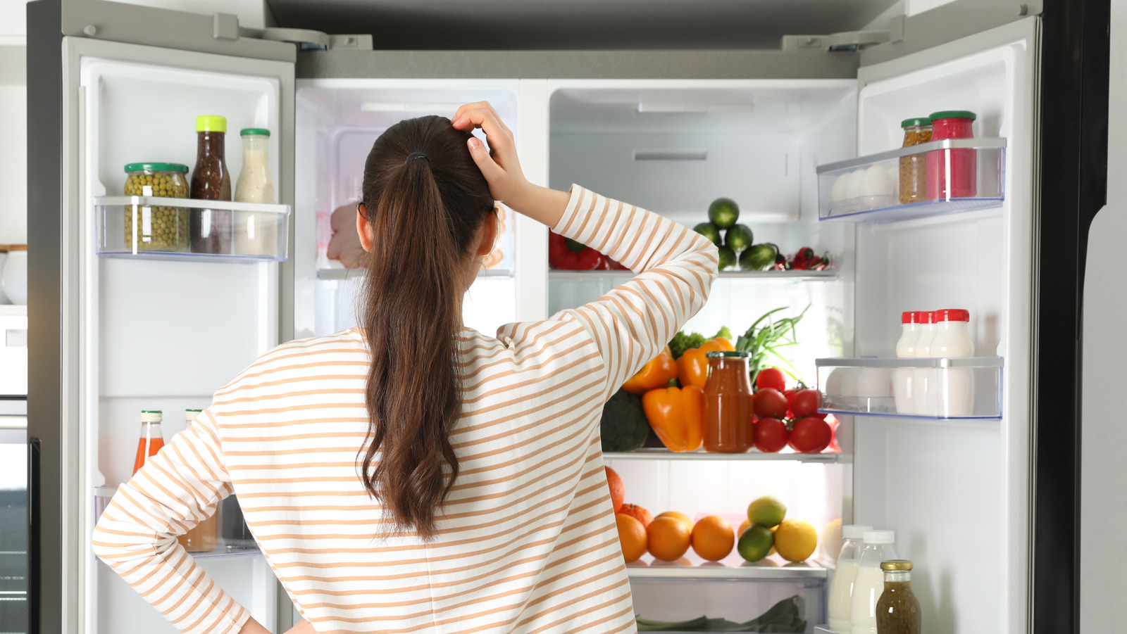 Why You Should Never Store Milk In Your Fridge Door