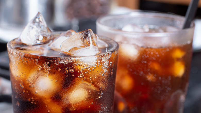 sodas in glasses with ice