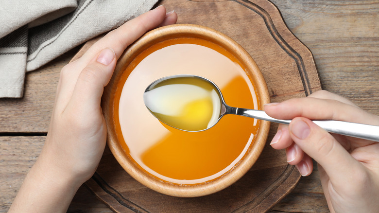 melted butter in a bowl with a spoon