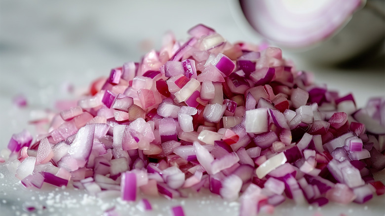 Pile of diced onions with white background