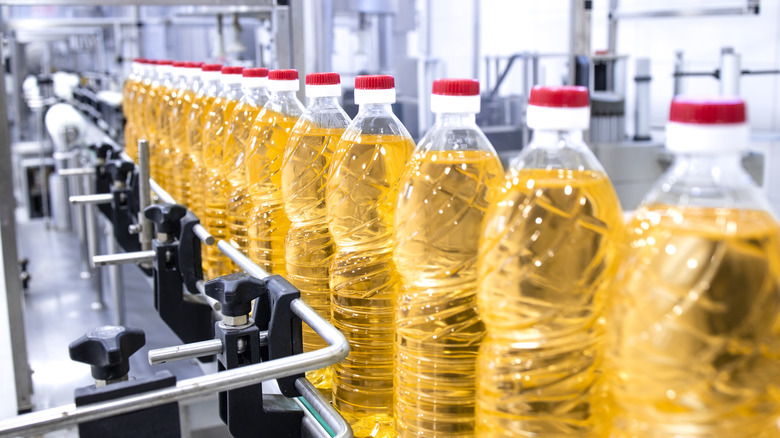 plastic oil bottles on a production line