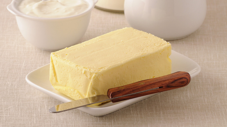 Butter with knife on dish