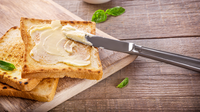 Butter on toast with knife