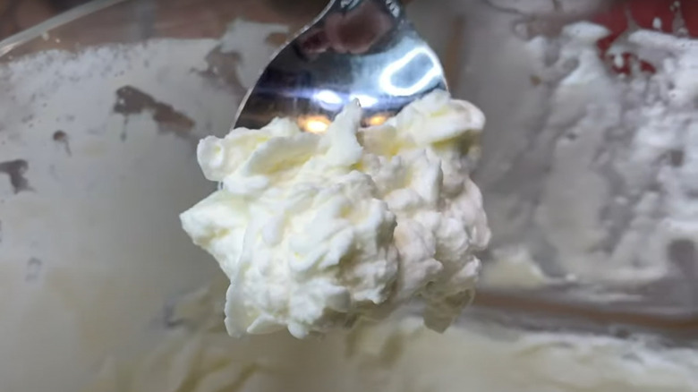 Whipped cream on spoon