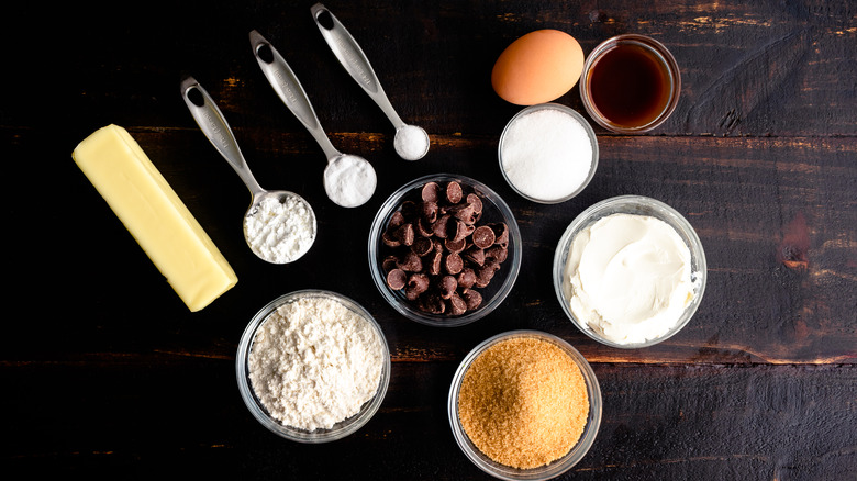 cookie ingredients on wood background