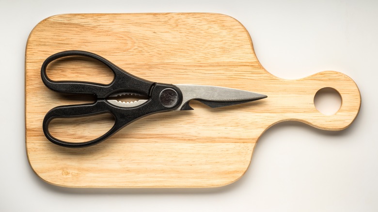 kitchen shears on cutting board