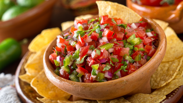 Pico de gallo in wooden bowl