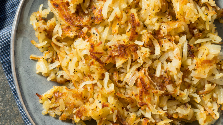 seasoned hashbrowns on gray plate