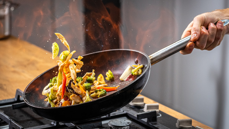 Sautéing vegetables over high heat