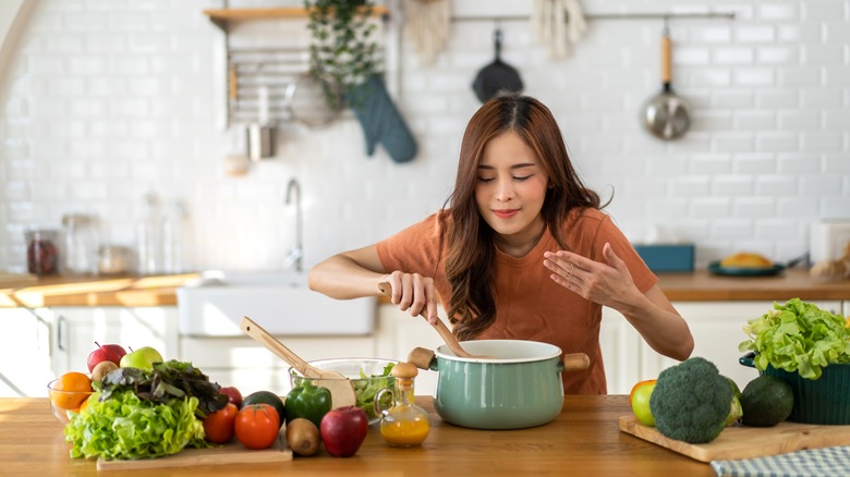 woman making soup