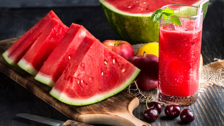 Sliced watermelon and glass of juice