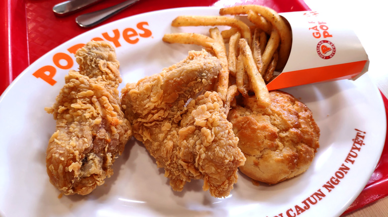 Popeyes chicken, biscuit, and fries