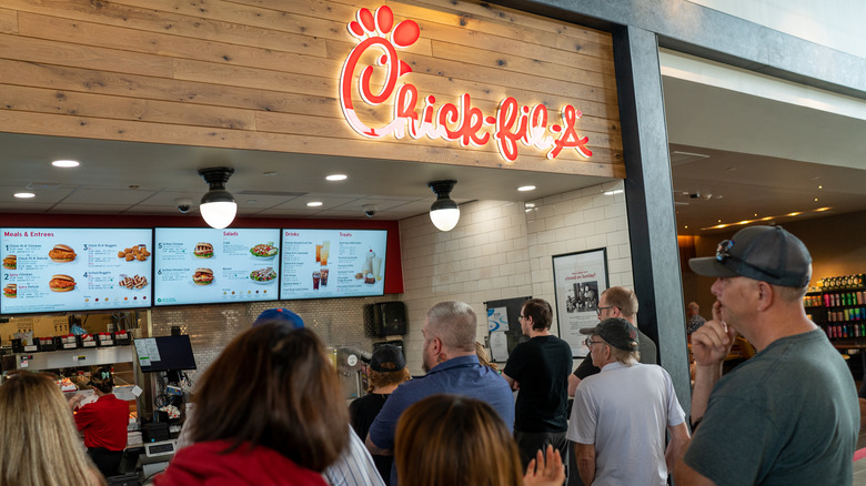 people ordering food at a food court chick-fil-a