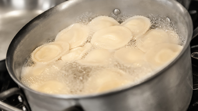 ravioli boiling in a pot of water