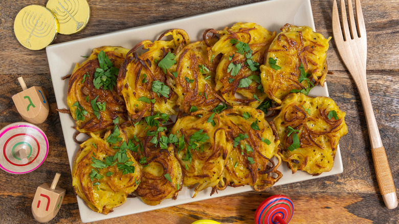 Latkes on tray with herbs