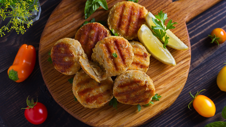 Fish patties surrounded by peppers