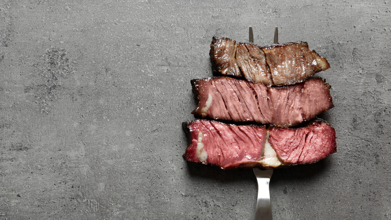 steak cooked to different temperatures