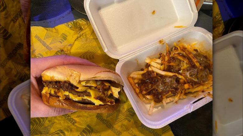 A Whataburger chili cheeseburger and some chili cheese fries.