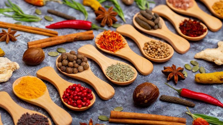 wooden spoons filled with spices