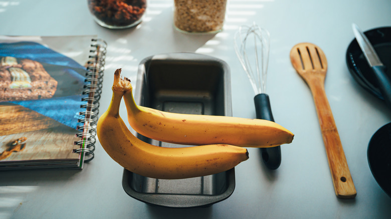 bananas and utensils on counter