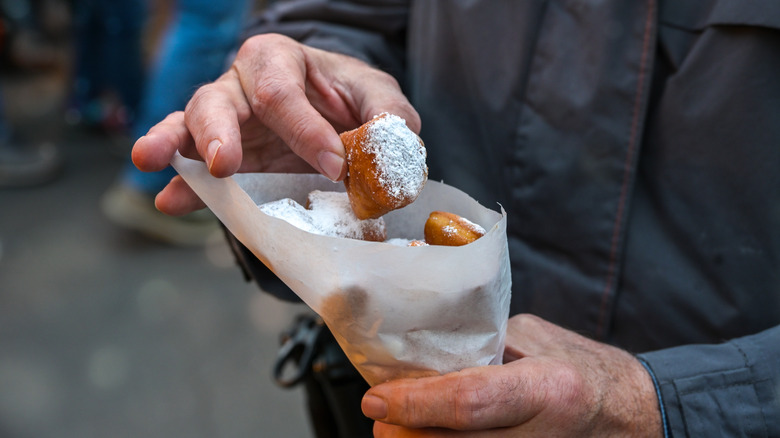 Deep fried pastry dough covered in sugar