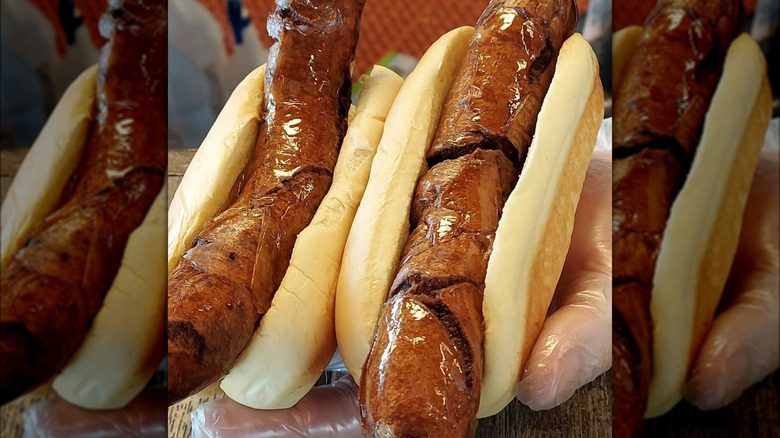 deep fried hot dog in hand